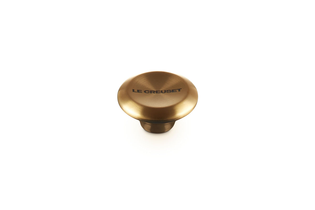 Le Creuset Signature Gold Knob Large closeup showing premium hardware that endures high oven temperatures.