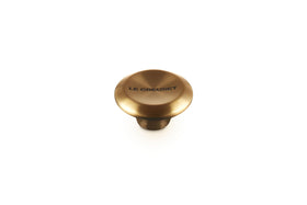 Le Creuset Signature Gold Knob Large closeup showing premium hardware that endures high oven temperatures.