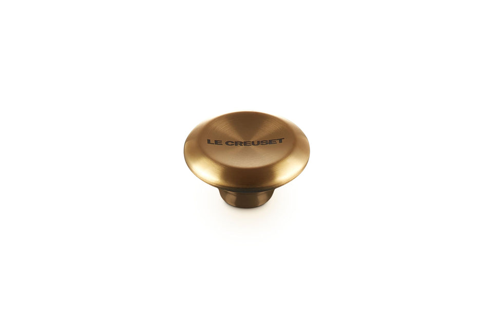 Le Creuset Signature Gold Knob Large closeup showing premium hardware that endures high oven temperatures.