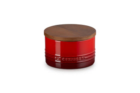 Le Creuset signature medium salt cellar with wood lid in cerise preserves freshness and counters clutter