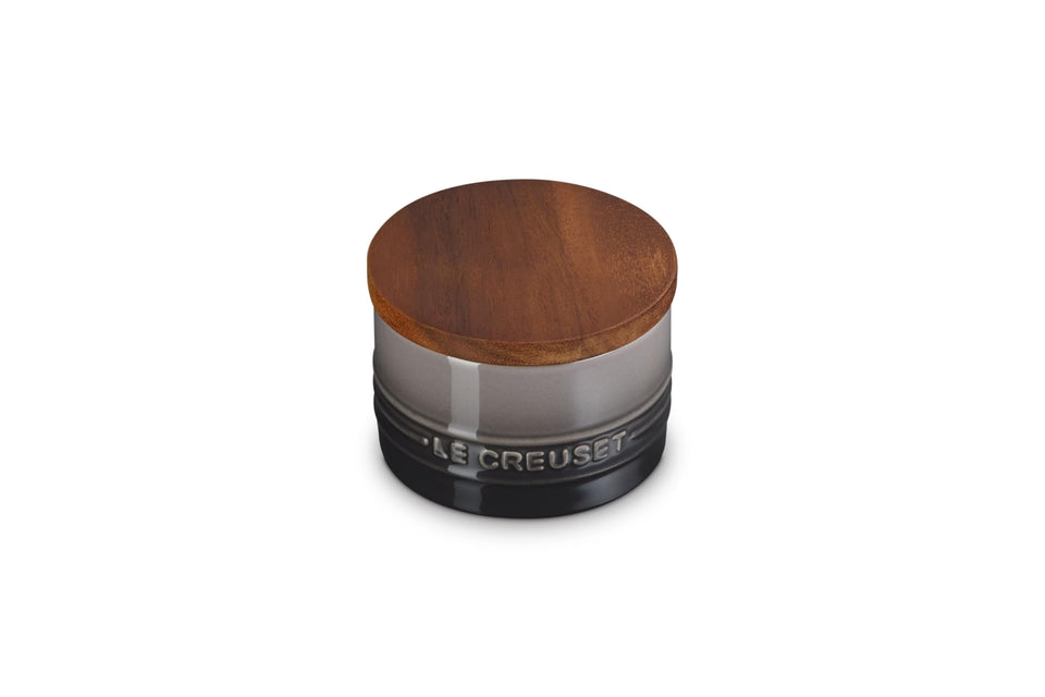 Le Creuset Signature small salt cellar with wood lid demonstrates tight seal for freshness.