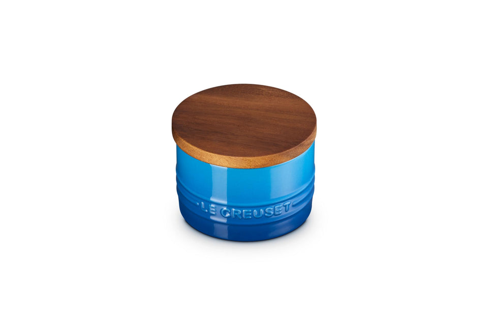 Le Creuset Signature salt cellar with wood lid preserves freshness on the counter.