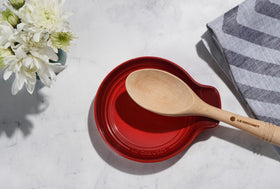 Close-up of Artichaut glaze on Le Creuset spoon rest shows a smooth, chip-resistant surface.