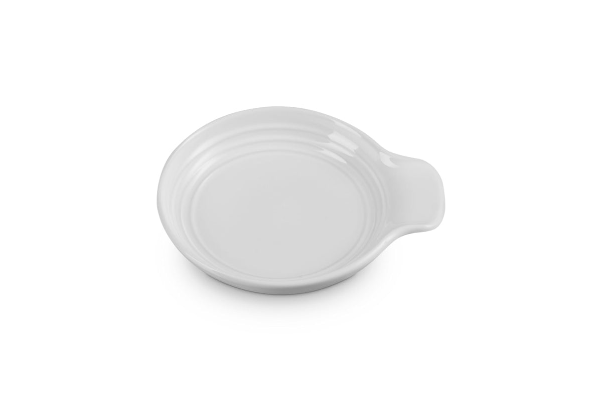 Le Creuset Signature spoon rest in white stoneware, 6 inches, keeps utensils off surfaces.
