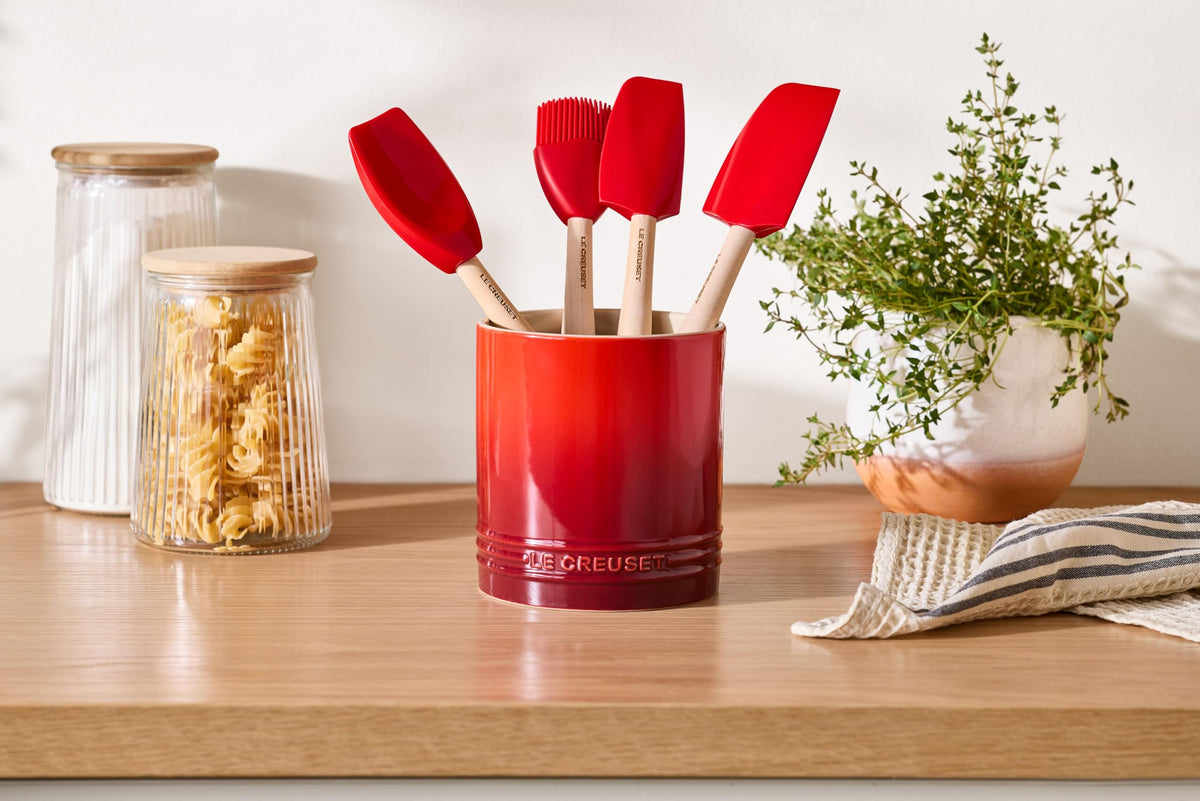 Le Creuset utensil crock with straight-wall design keeps utensils upright while cooking.