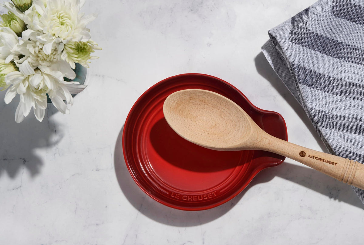 Cerise Le Creuset spoon rest with glaze resists stains for long-lasting color.