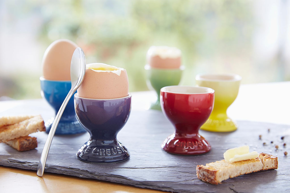 Le Creuset stoneware egg cup with colorful glaze, easy release and cleanup.