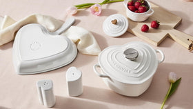 Le Creuset interior enamel releases food easily for quick cleanup.