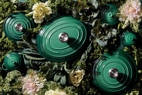 Le Creuset butter dish Artichaut on table adds rustic kitchen charm.