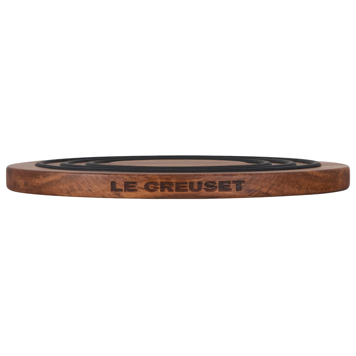 Le Creuset trivet magnet attaches to cookware bottom for quick serving.