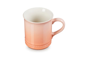 Le Creuset Vancouver Mug Peche, front view, durable stoneware keeps beverages warm.