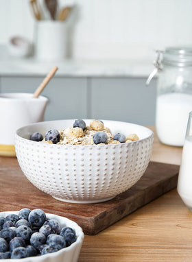 LE TAUCI Arctic White stackable design saves cabinet space and decor.