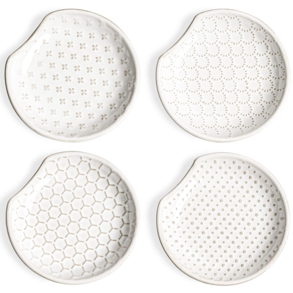 LE TAUCI ceramic spoon rests sit on the counter to keep drips tidy.