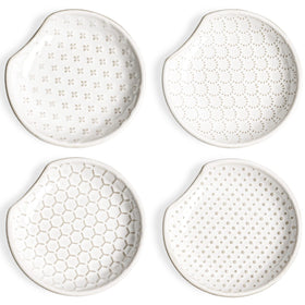 LE TAUCI ceramic spoon rests sit on the counter to keep drips tidy.