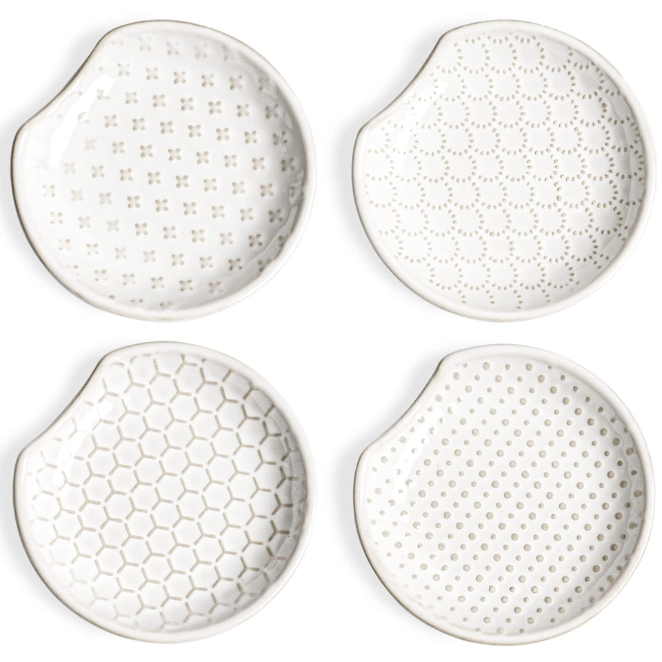 LE TAUCI ceramic spoon rests sit on the counter to keep drips tidy.