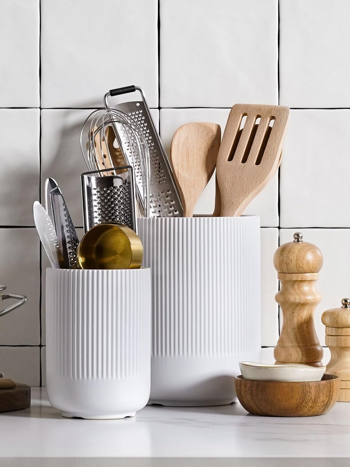 LE TAUCI ceramic crocks provide a stable base for daily kitchen tools