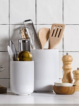 LE TAUCI ceramic crocks provide a stable base for daily kitchen tools