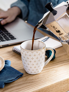 LE TAUCI mug interior white glaze shows coffee color clearly.