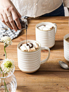 LE TAUCI unglazed bottom shows natural clay texture on each mug