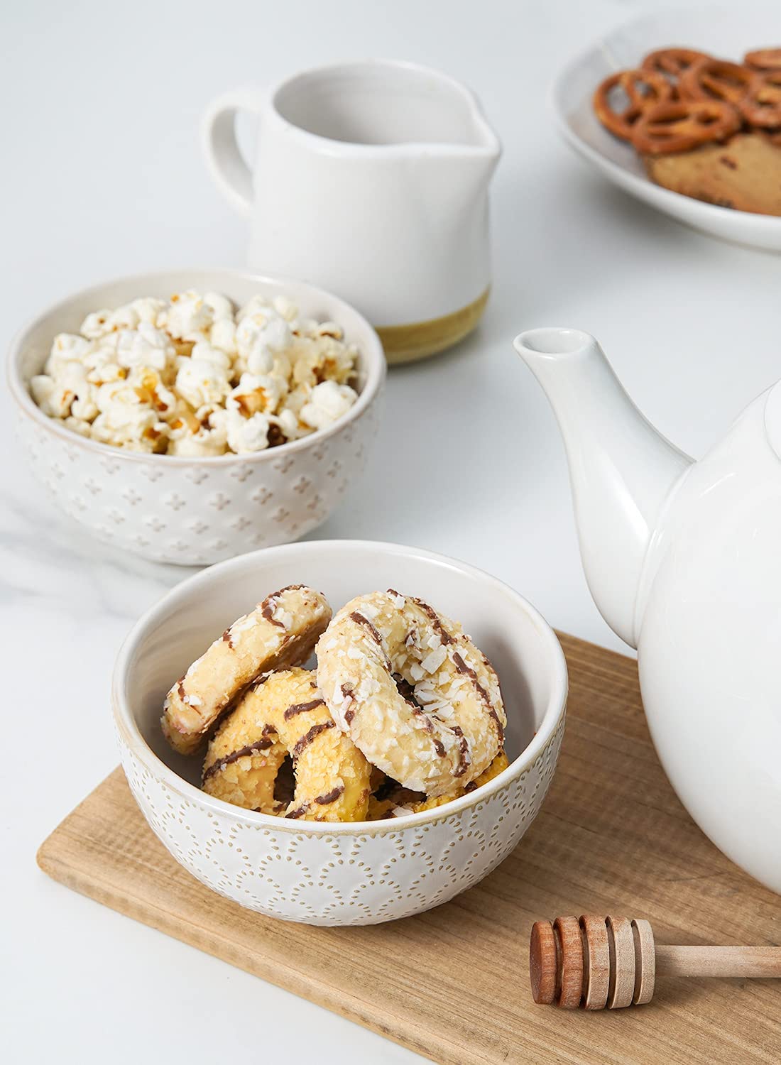 LE TAUCI four-piece set makes a thoughtful housewarming gift.