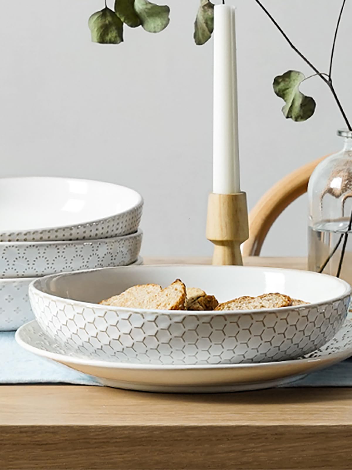 LE TAUCI pasta bowls in use beside pasta dish with ample space for sauce.
