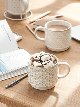 LE TAUCI embossed-pattern detail highlights four textures for elegant coffee moments