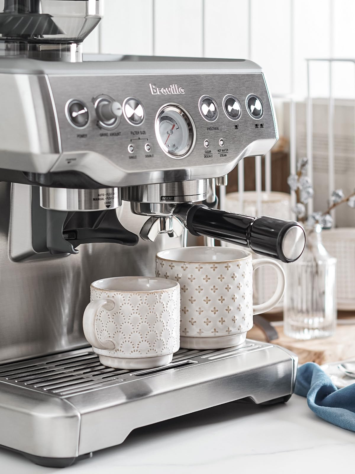 LE TAUCI stackable mugs close-up on the stand showing smooth ceramic finish