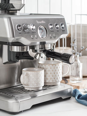 LE TAUCI stackable mugs close-up on the stand showing smooth ceramic finish