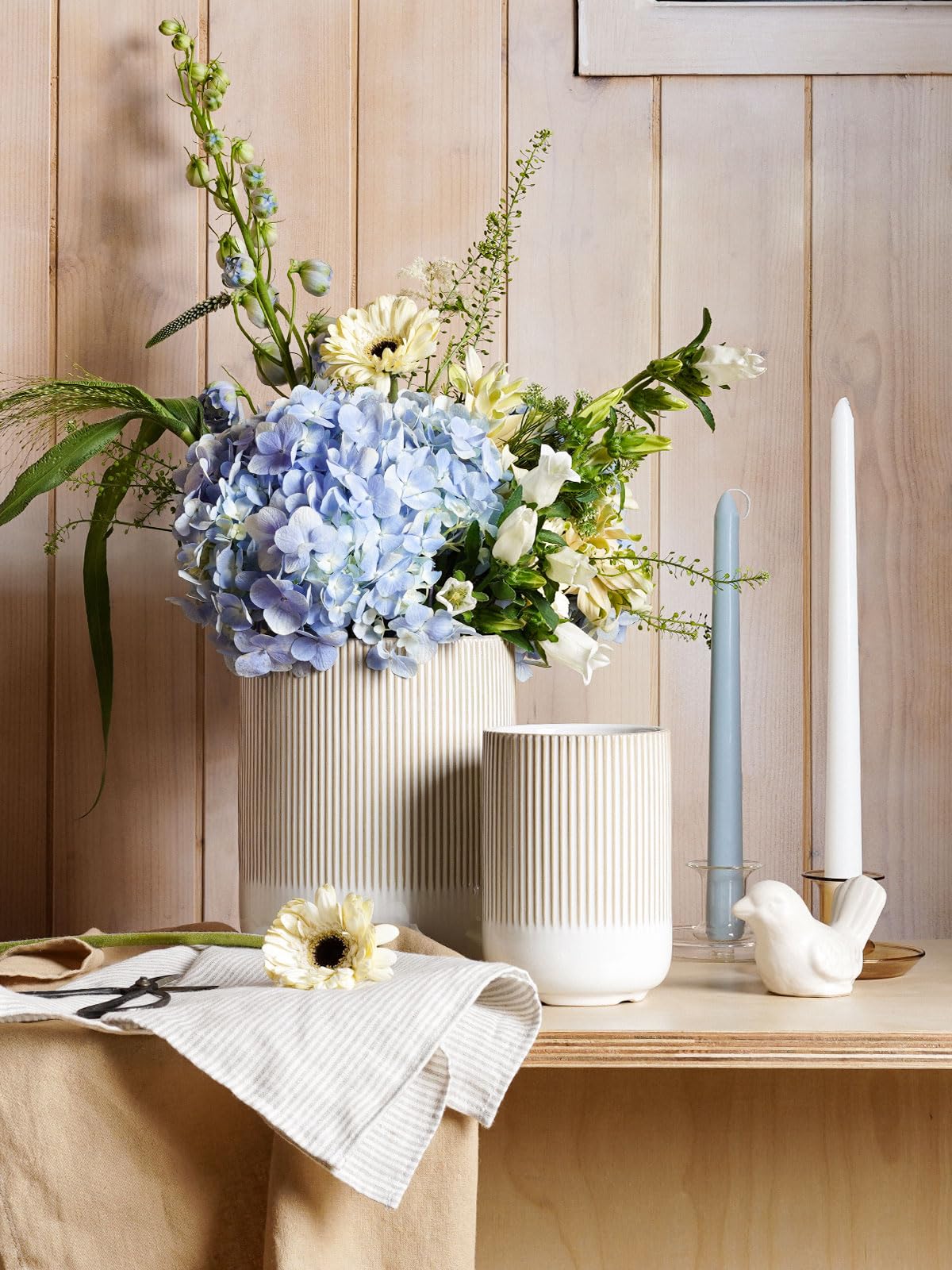 LE TAUCI warm white glaze detail highlighting fluted texture on the crock.