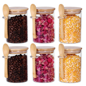 Leaves and Trees Y glass jar set with bamboo lids arranged for pantry storage