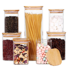 Leaves and Trees Y small glass canisters with bamboo lids for flour and sugar storage.