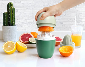 Lechin Hand Juicer in vibrant green adds kitchen style.