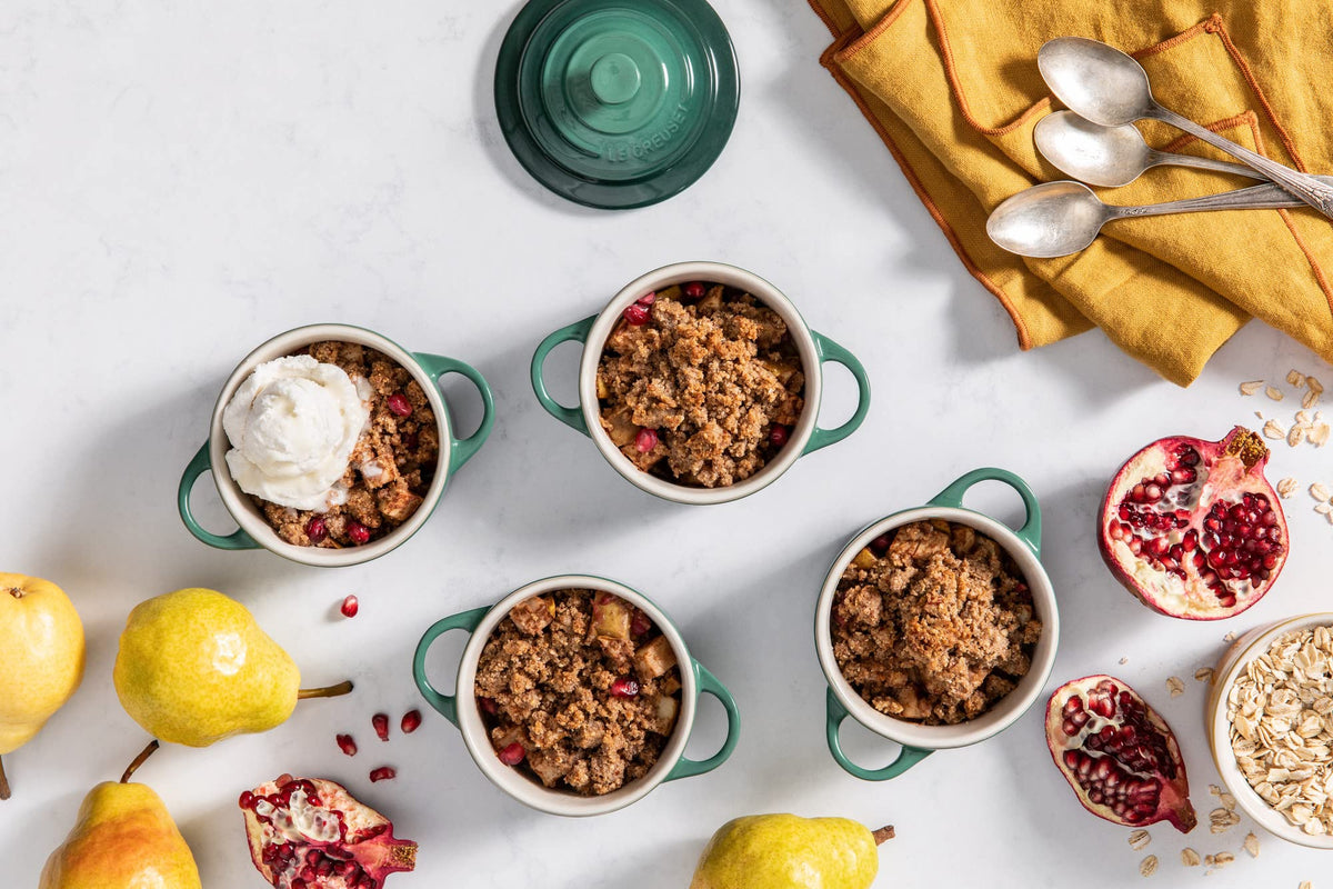 Le Creuset mini round cocotte Artichaut styled on the table for colorful presentation
