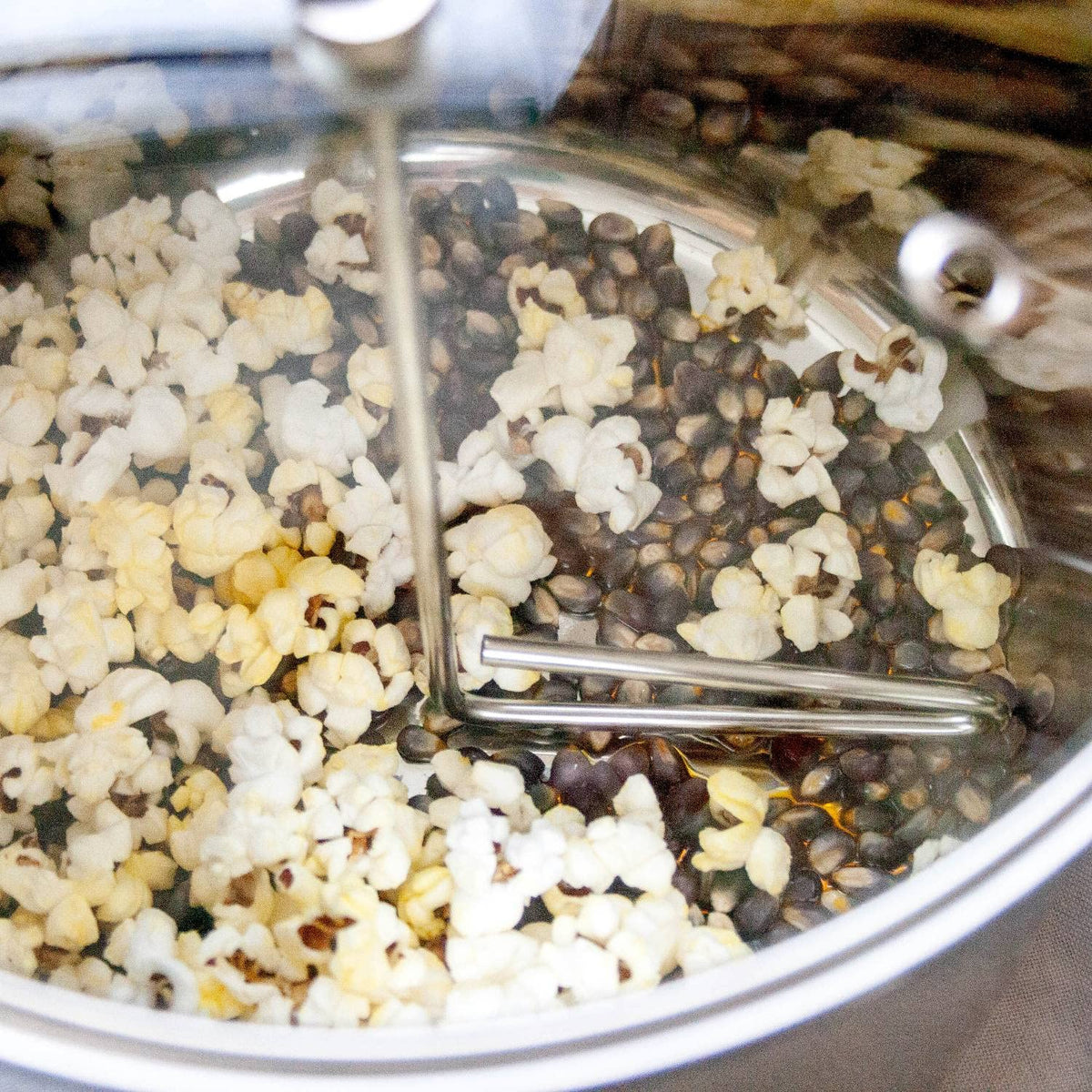 Lehman's popper lid with oversized steam holes keeps popcorn crispy.