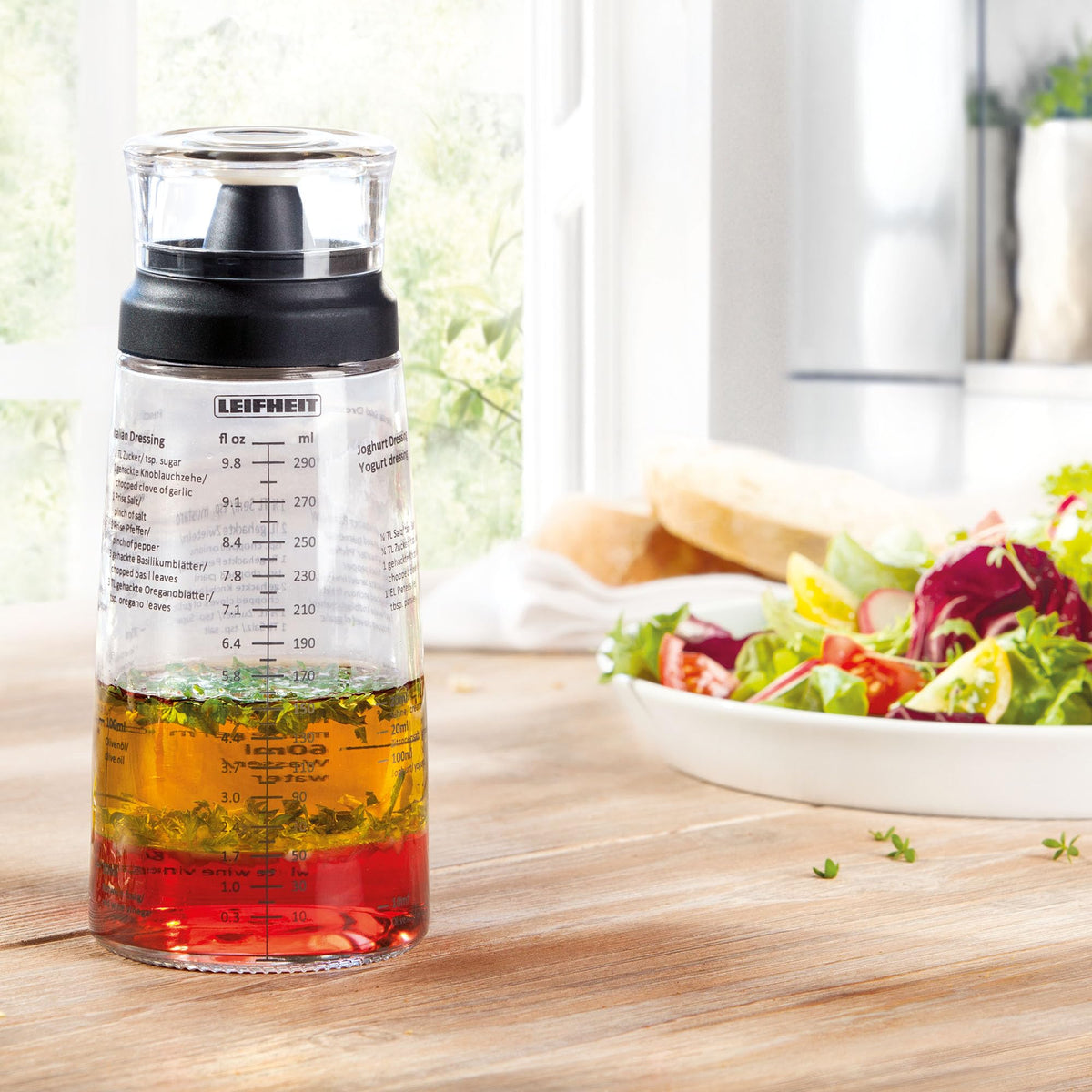Leifheit dishwasher-safe glass bottle for easy cleanup after dressings.