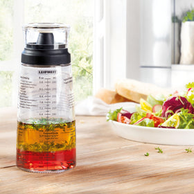 Leifheit dishwasher-safe glass bottle for easy cleanup after dressings.