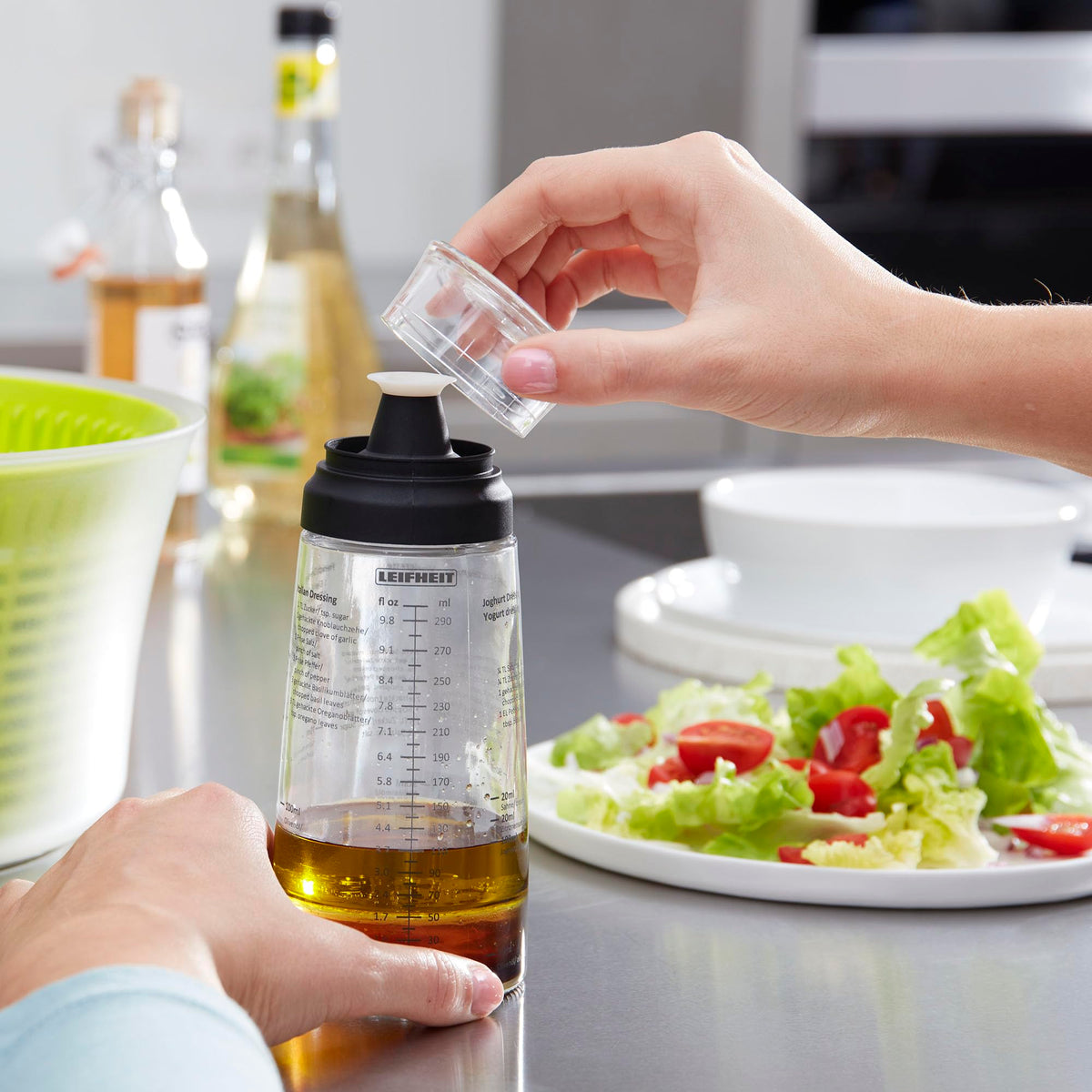 Leifheit ridged base keeps bottle steady on slick counters.