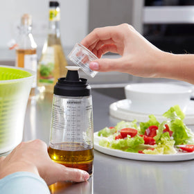 Leifheit ridged base keeps bottle steady on slick counters.