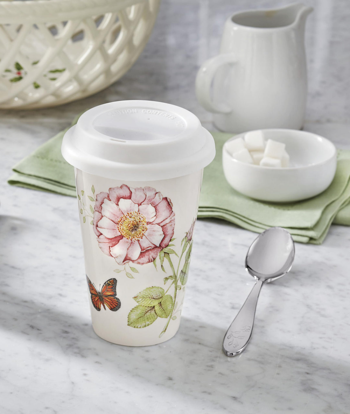 Lenox Butterfly Meadow mug handle detail showcases ergonomic grip for comfortable travel.
