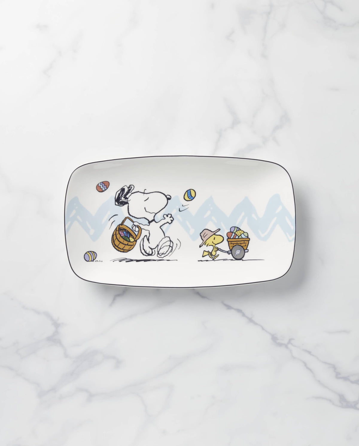 Lenox Peanuts Easter Snoopy egg hunt scene on porcelain tray for celebrations.