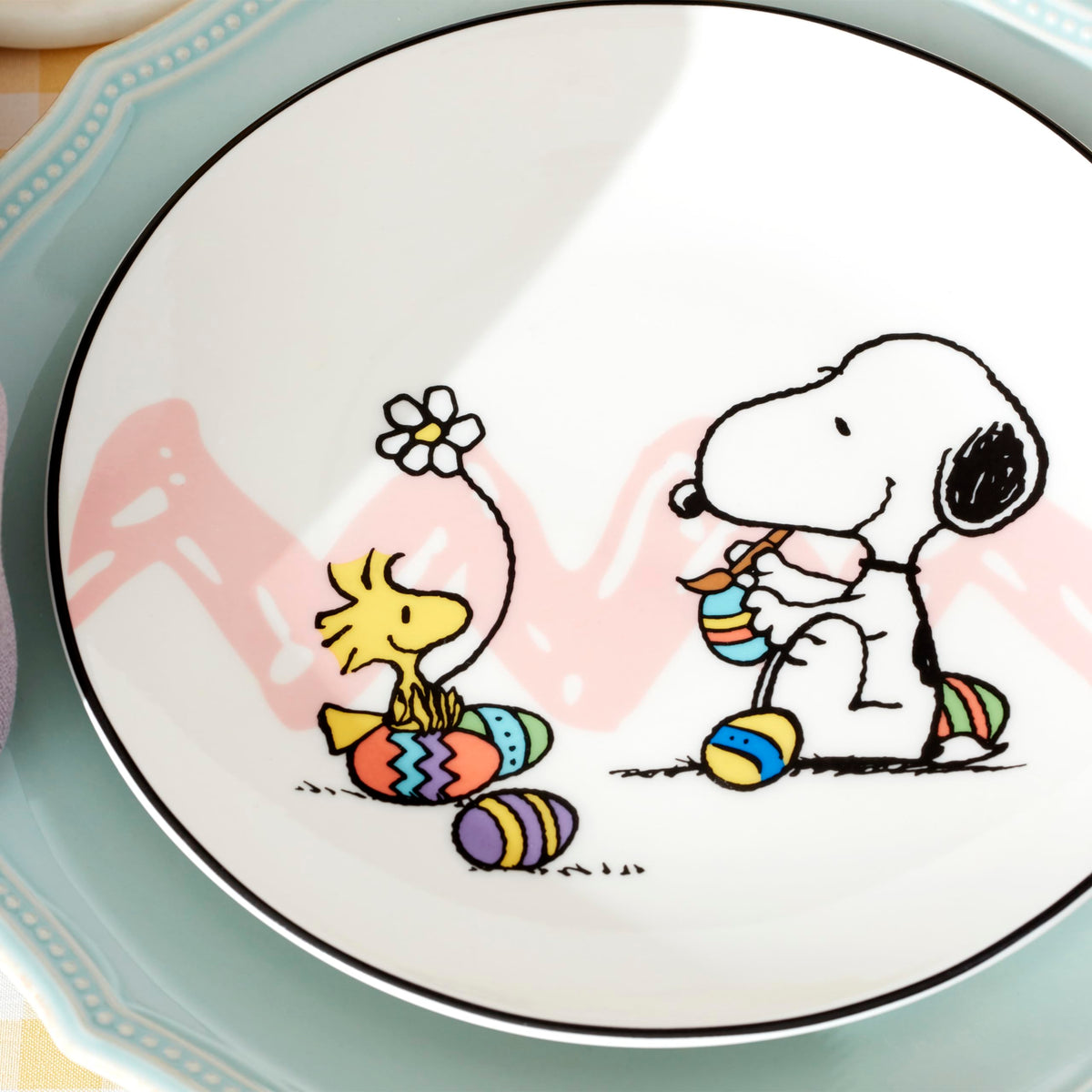 Lenox Snoopy wheelbarrow eggs plate adds playful Easter centerpiece.