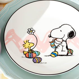 Lenox Snoopy wheelbarrow eggs plate adds playful Easter centerpiece.