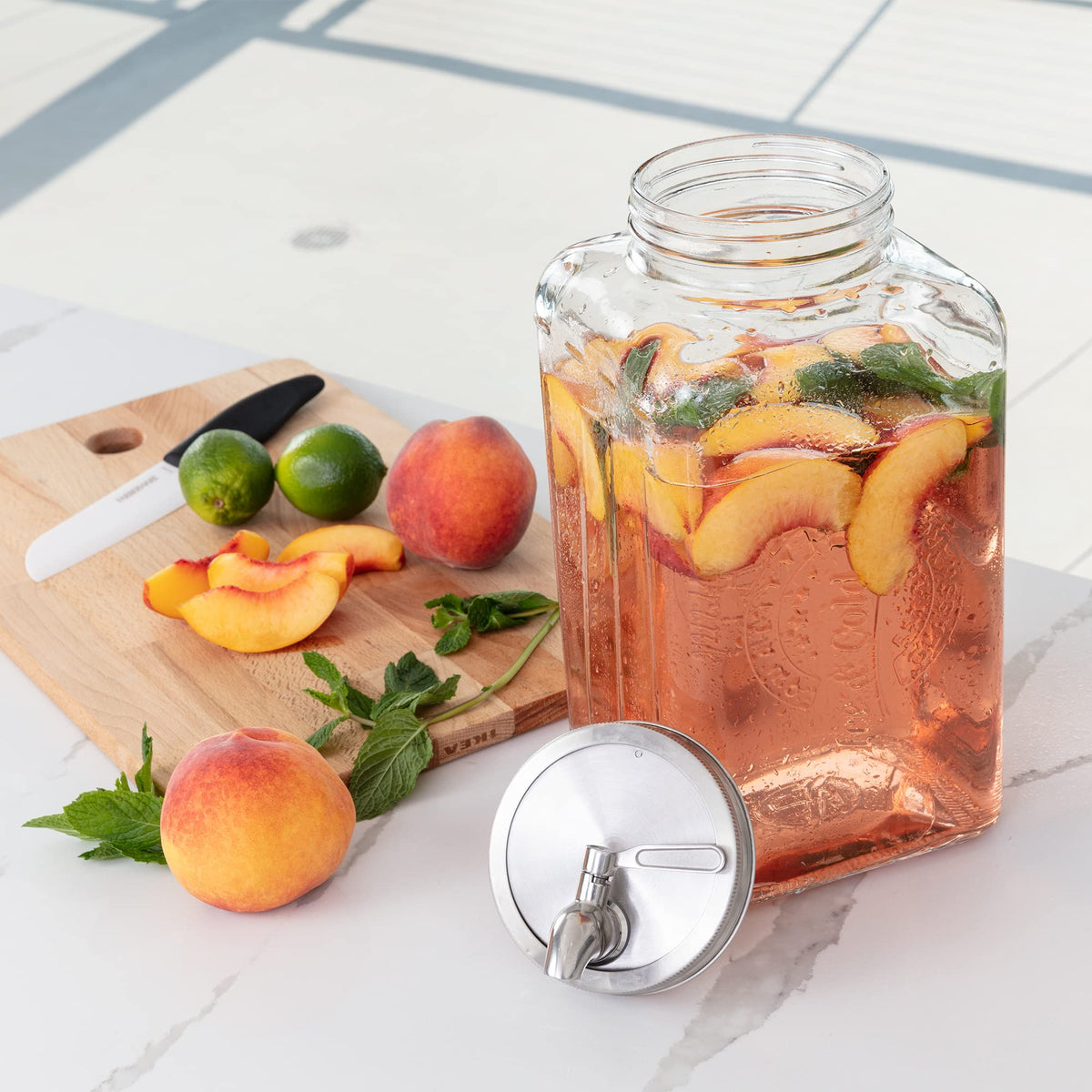Le'raze setup showcases fruit-infused beverages in a glass dispenser