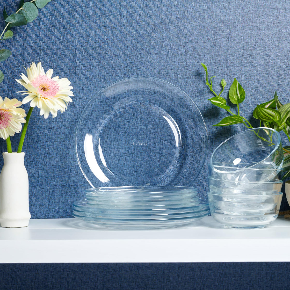 Le'raze dishware ready for dishwasher cleaning in a busy kitchen.