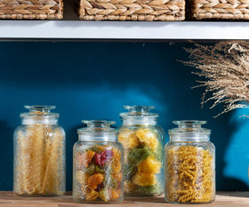 Le'raze kitchen pantry organization with clear canisters on shelf.