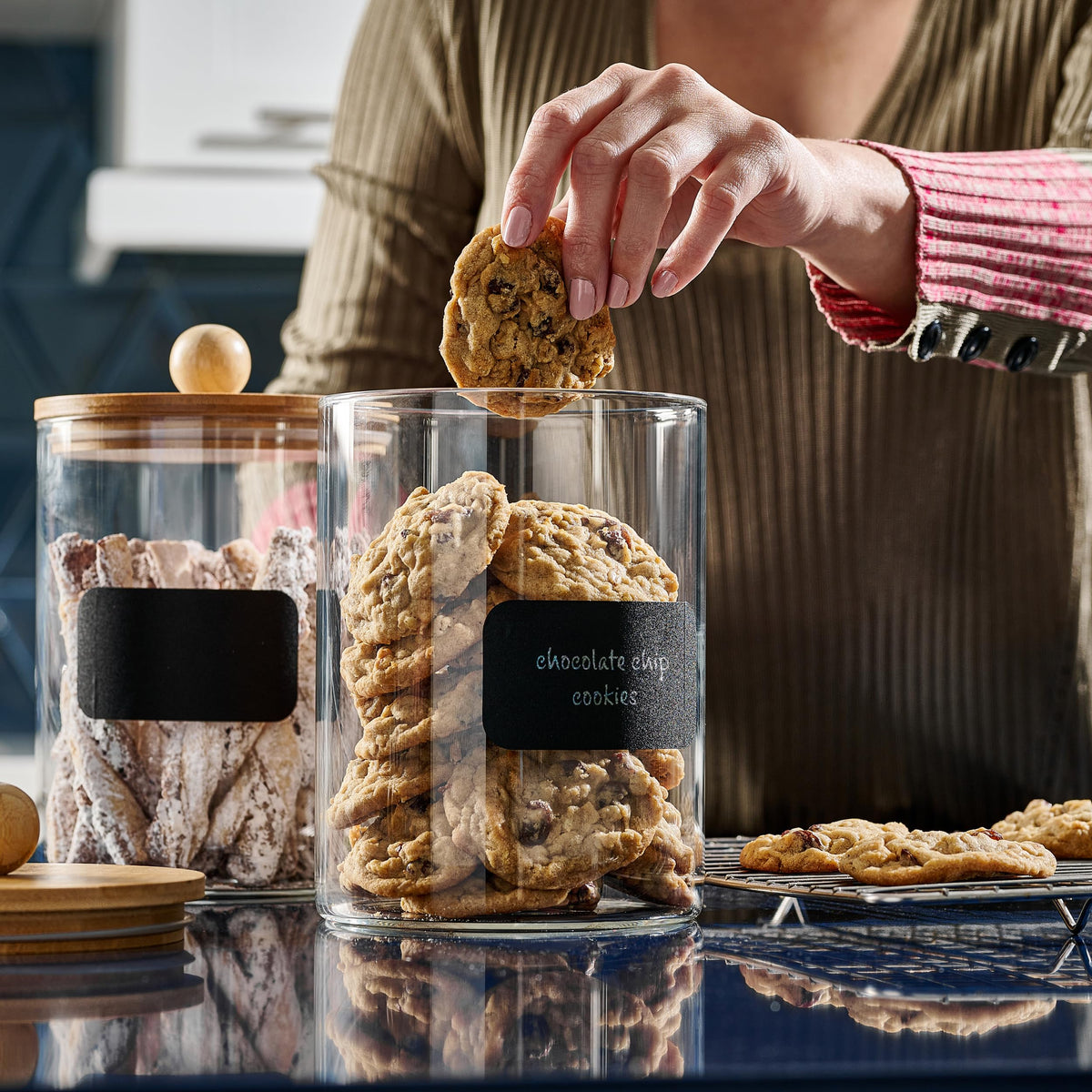 Le'raze canisters in pantry with coffee beans, tea, and spices visible.