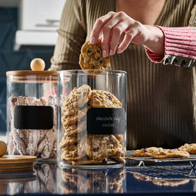 Le'raze canisters in pantry with coffee beans, tea, and spices visible.