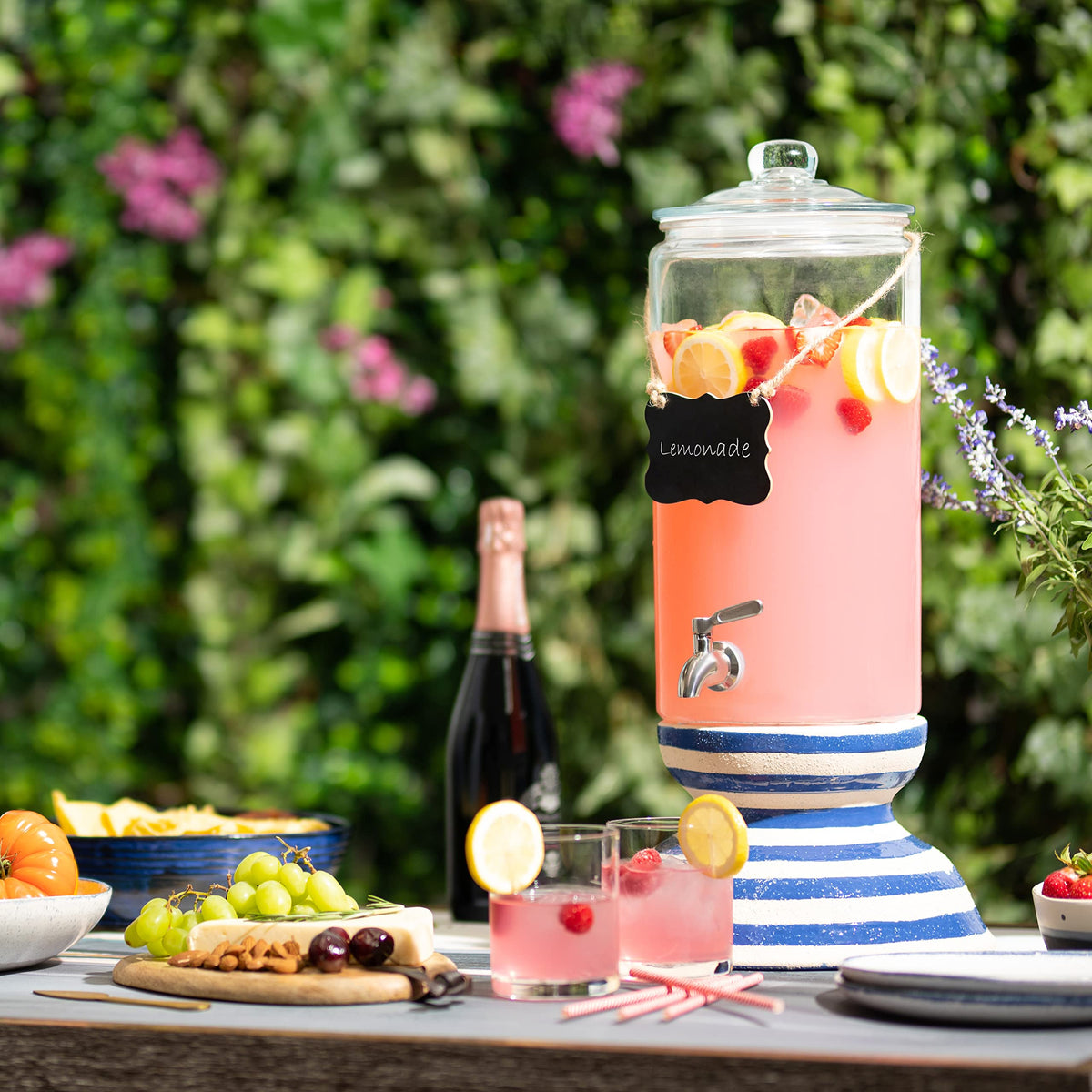 Le'raze wide-mouth lid on a glass beverage dispenser