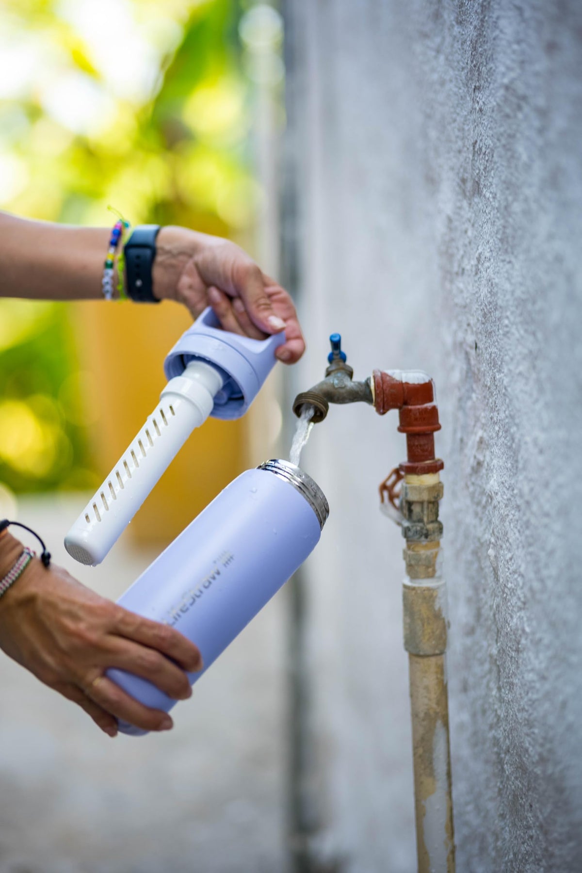 LifeStraw Go Series carbon filter in use, improves taste by removing odors.