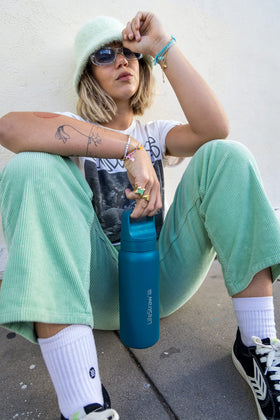 LifeStraw Go Series bottle during hiking, showcasing durability in rugged environments